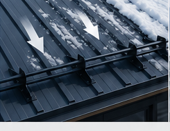 Snow sliding down metal roof toward snow guard